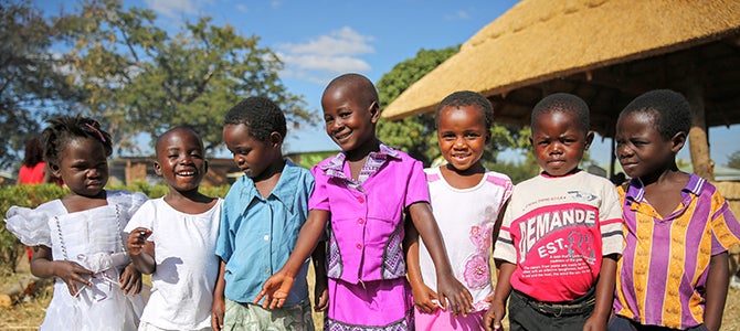 The Nu Skin Family Visits Malawi 2017
A group of Malawi children pose for a picture as they attend the School for Agriculture For Family Independence graduation.